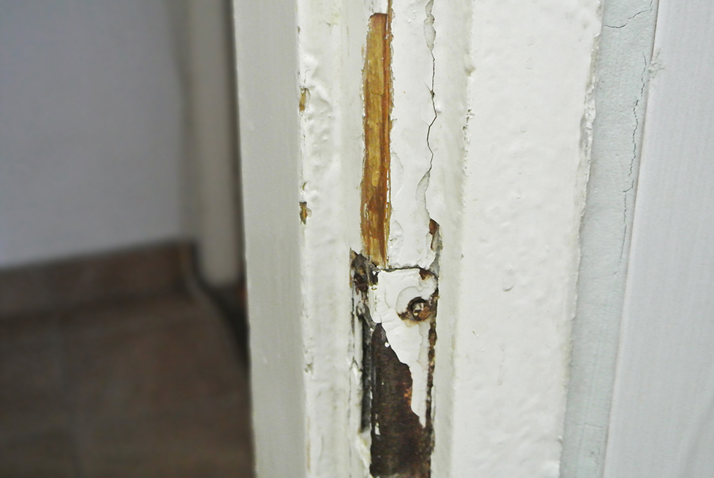 Wood paint peeling on door frame, 123RF, pavlematic