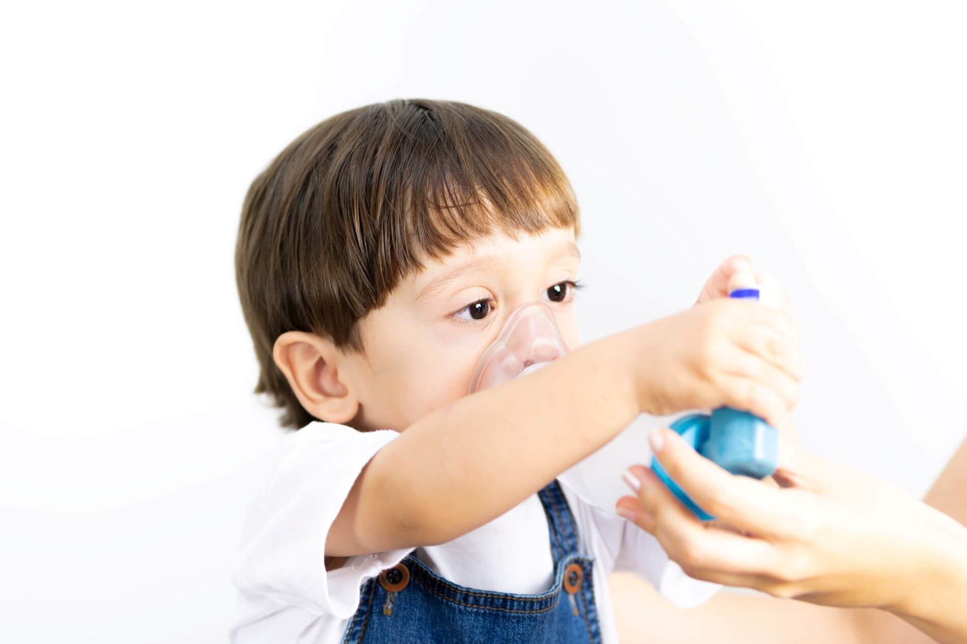 Child using inhaler.