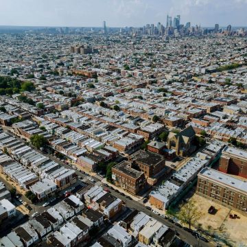 A look at the city Philadelphia skyline and the roofs of houses.