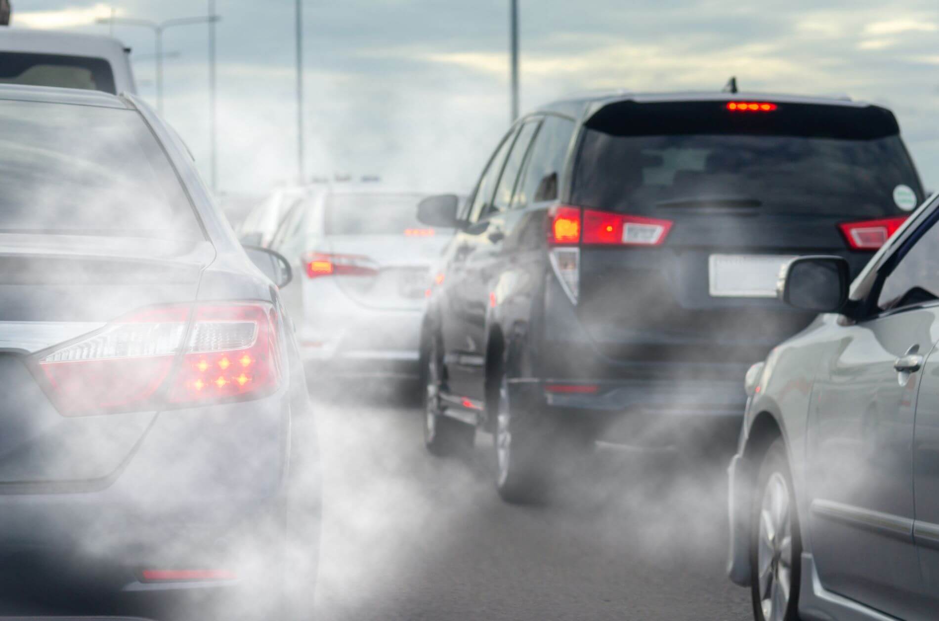 Air pollution around cars on a highway.
