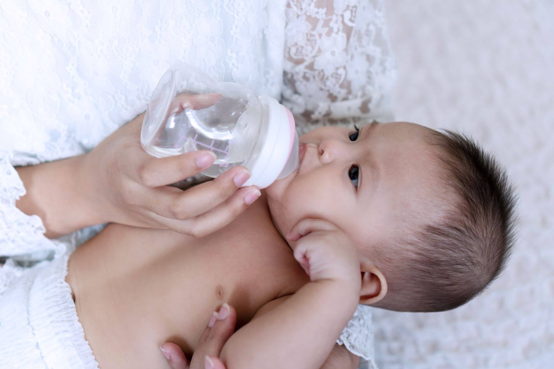 Baby drinking from a bottle.