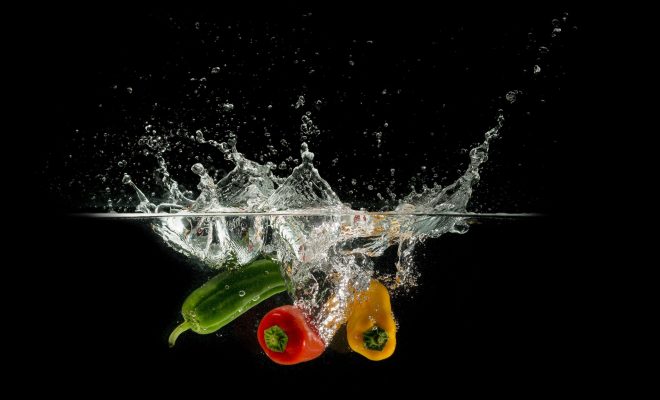 Fruits and vegetables dunked in water.