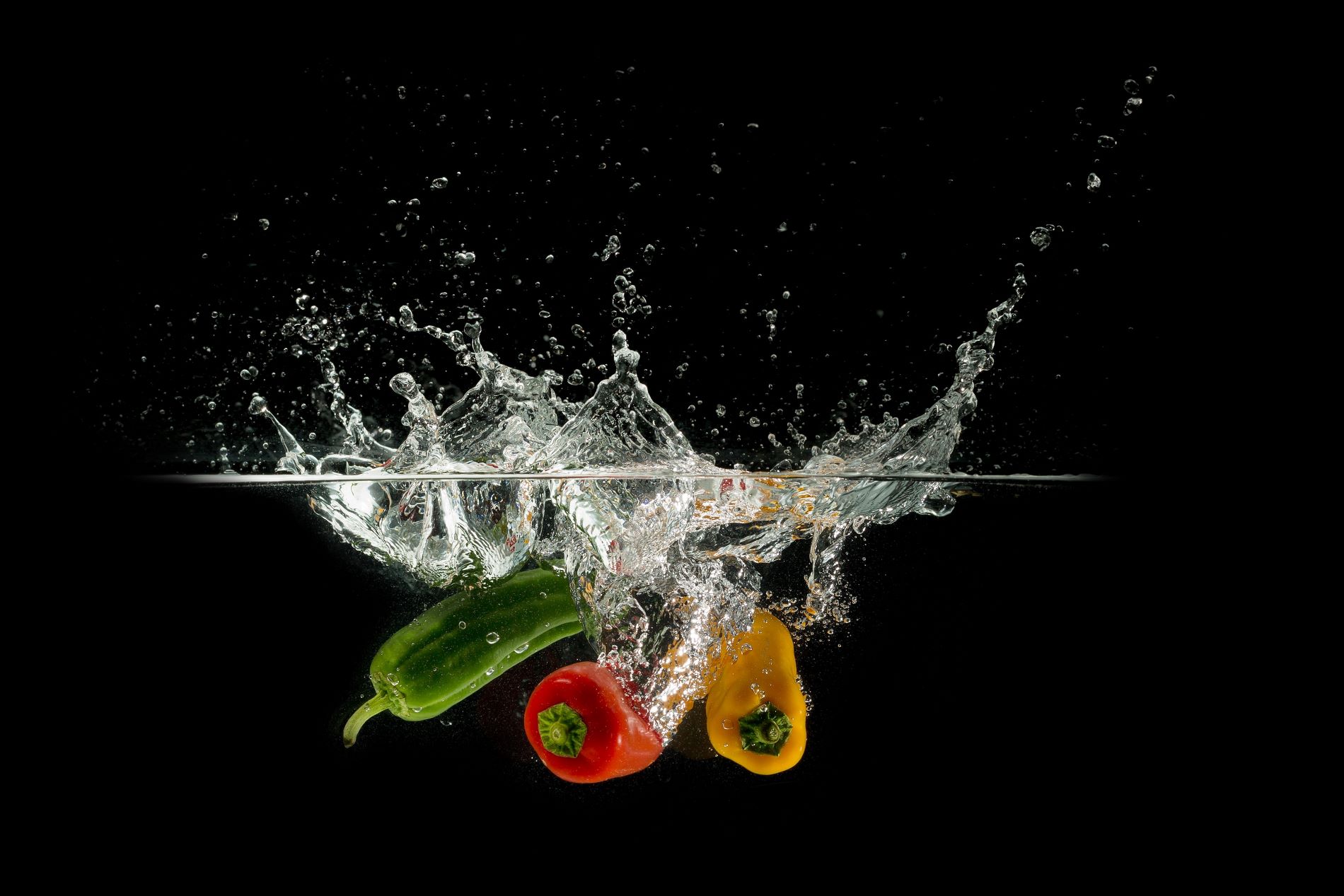 Fruits and vegetables dunked in water.