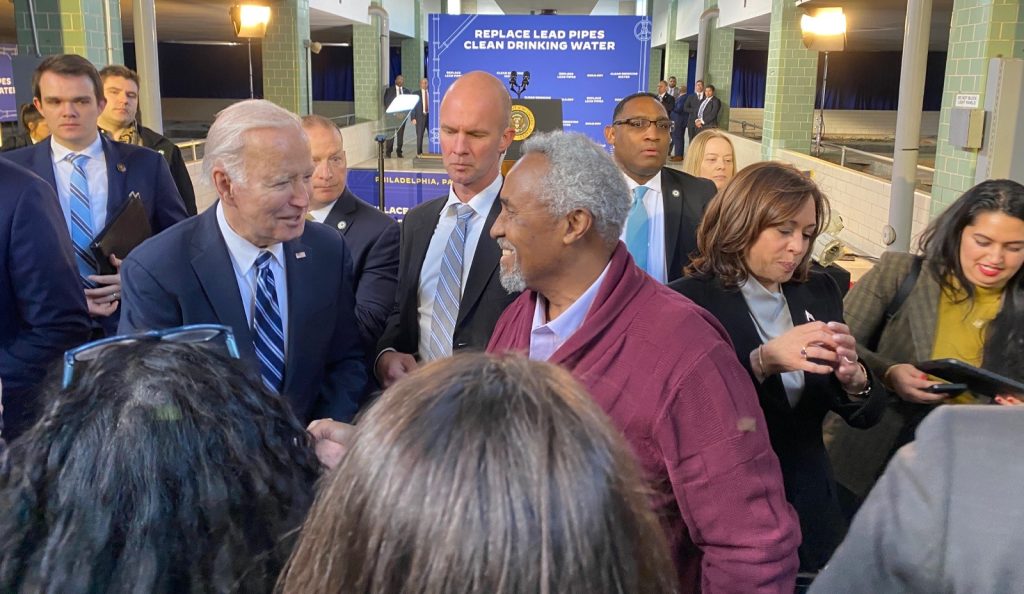 Maurice Sampson and President Biden shaking hands at lead pipe removal funding event