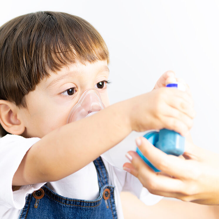 Child with asthma inhaler