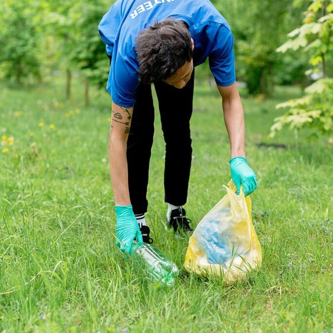 Volunteer cleaning up park.